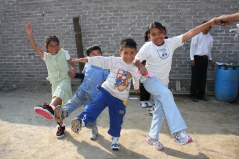 Children in Mexico City receive shoes (Photo: Business Wire)