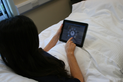 MEDIVista MOBILE in use by a patient to access a range of services including live TV and Movies on D ...