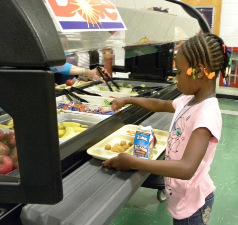 A first grade student at Grandview Elementary School in Piscataway, NJ enjoys the school's new salad ... 