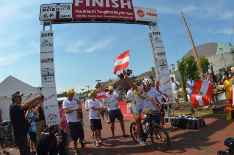 Austrian cyclist, Christoph Strasser crosses the finish line of the 3,000 mile transcontinental Race ... 