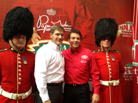 Papa John's founder, chairman, and CEO, John Schnatter, second from right, and Tony Thompson, Papa J ...