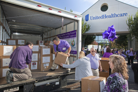 UnitedHealthcare employees on Wednesday, Oct. 30, load boxes of food onto a truck to be delivered to ... 