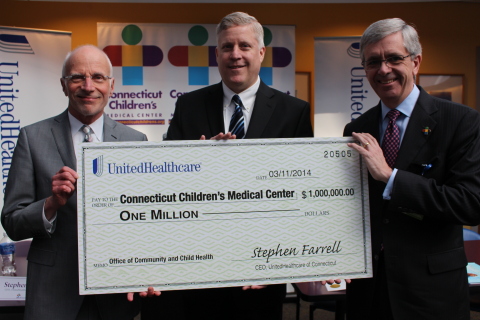 Stephen Farrell, CEO of UnitedHealthcare of New England (center), presents a $1 million grant to Dr. ... 