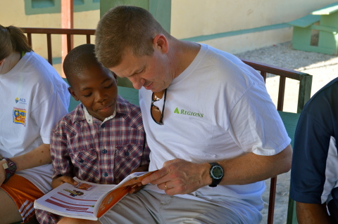 James Dusenberry reads with Jobenson Charles, a child who lives at the orphanage James' church found ... 