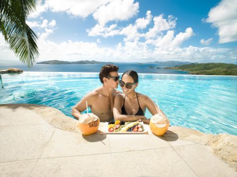 Couple relaxing at the stunning Peter Island Resort and Spa (Photo: Business Wire)