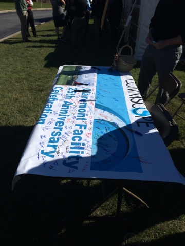CommScope employees sign a banner celebrating the Claremont, NC facility's 25th anniversary. (Photo: ... 