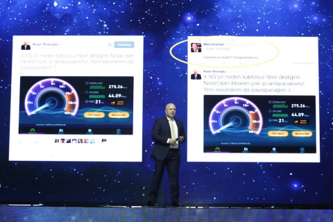 Turkcell CEO Kaan Terzioglu on stage with 4.5G speed test on screen during Turkcell's 8th annual Tec ... 