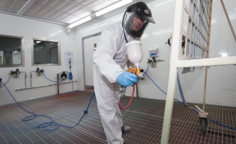 Ian Toole, PPG process application development, Europe, Middle East and Africa, aims a paint spray g ... 