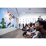 In this photo provided by Nintendo of America, Nintendo fan, Joseph Osei, gathers at the Nintendo NY store in New York on June 14, 2016, to watch Nintendo Treehouse: Live, which was live-streamed from the E3 video game trade show in Los Angeles. During the live stream, Nintendo announced The Legend of Zelda: Breath of the Wild and highlighted the immense, living and breathing open-air adventure where challenge and surprise await at every turn. In this photo provided by Nintendo of America, Nintendo fan, Joseph Osei, gathers at the Nintendo NY store in New York on June 14, 2016, to watch Nintendo Treehouse: Live, which was live-streamed from the E3 video game trade show in Los Angeles. During the live stream, Nintendo announced The Legend of Zelda: Breath of the Wild and highlighted the immense, living and breathing open-air adventure where challenge and surprise await at every turn.