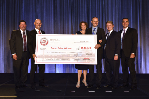 Top Tech winner Darek Mowinski shows off his $50,000 check alongside his wife Carlene and (from left ... 