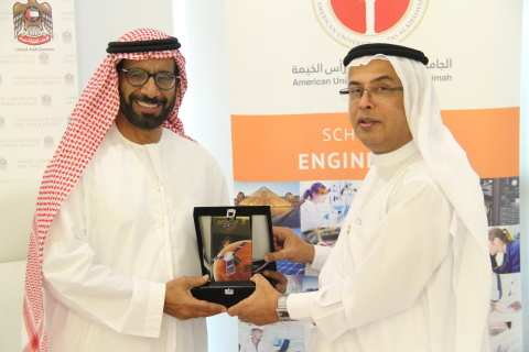 Professor Al Alkim and H. E. Dr. Al Romaithi exchange tokens of appreciation following the signing o ... 