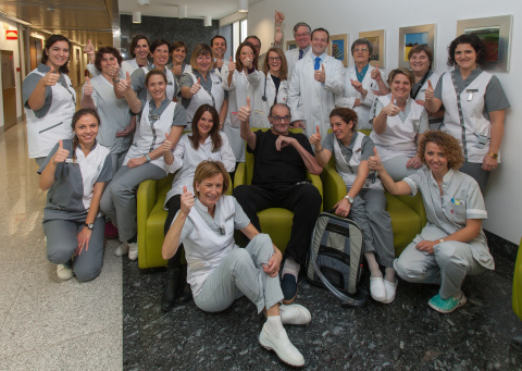 Oscar, the first patient to receive the SynCardia Total Artificial Heart in Spain, poses with his me ... 