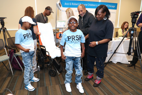 At 11 years old, Jaheim Whigham (center) is the youngest and smallest patient to receive the 50cc Sy ... 