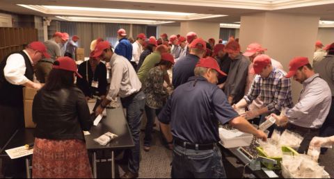 Lincoln IT Leaders Package Meals for Rise Against Hunger (Photo: Business Wire)