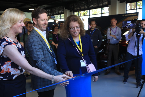 Intel's Kathy Winter, (from left) Doug Davis and Patti Robb cut the entrance ribbon, officially open ... 