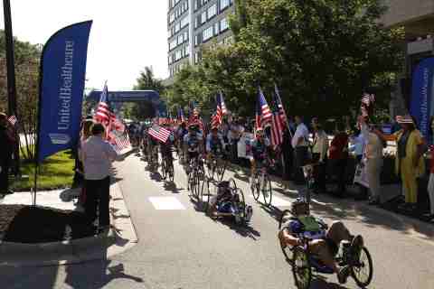 More than 150 wounded veterans and supporters depart UnitedHealthcare headquarters in Minnetonka to ... 