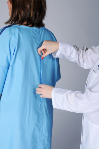 The new gown is closed in the back, with an opening that folds over, allowing for clinical access to the patient by hospital staff. (Photo: Business Wire)