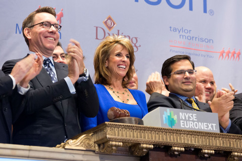 Taylor Morrison President and Chief Executive Officer Sheryl Palmer in the center of the trading crowd as the company's stock opens on the NYSE. (Source: NYSE Euronext photo)