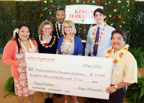 King's Hawaiian CEO Mark Taira and his daughter Courtney Taira present Project Mahalo donations to representatives of Big Brothers Big Sisters of America, Family Caregiver Alliance, Meals On Wheels Association of America and One Warm Coat at the King's Hawaiian headquarters on May 1, 2013, in Torrance, California. Project Mahalo is a King's Hawaiian charitable initiative which honors the contributions made in communities throughout the United States by these four charitable organizations. The event was held on the traditional Hawaiian holiday of Lei Day. (Photo: Business Wire)