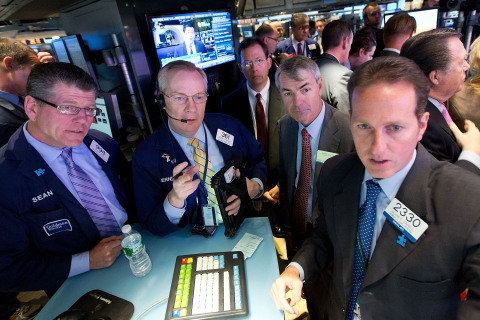 Cyan Chairman and Chief Executive Officer Mark Floyd in the center of the trading crowd as the company's stock opens on the NYSE. (Source: NYSE Euronext Photo)
