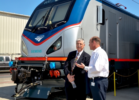 Joe Boardman, Amtrak president & CEO, and Michael Cahill, president of Siemens Rail Systems division in the U.S., with one of the new advanced technology locomotives that will improve reliability, efficiency and mobility in the Northeast. (Photo: Business Wire)