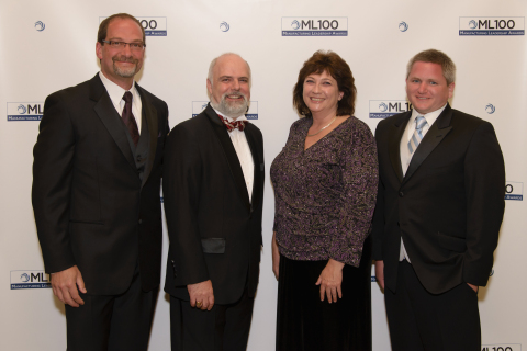 Technologists from GE Global Research accept a ML100 "Innovative Enterprise Award" in recognition of their work to build a crowdsourcing software platform which allows for the collaborative online development of complex cyber-physical systems. Pictured (l-r) Computer Scientist, Thomas Citriniti; Business Integration Technologies Lab Manager, Joseph Salvo; Technology Director for Manufacturing and Materials Technologies, Christine Furstoss; and Computer Scientist, Benjamin Beckmann. (Photo courtesy Manufacturing Executive/Frost & Sullivan)