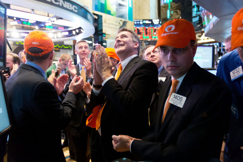 Gigamon Chief Executive Officer Paul Hooper in the center of the trading crowd as the company's stock opens on the NYSE. (Source: NYSE Euronext Photo)