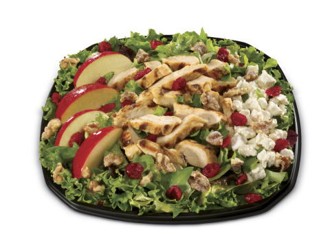 The new Cranberry Apple Walnut Grilled Chicken Salad, available at Carl's Jr. today, features a variety of flavors and premium ingredients. (Photo: Business Wire)