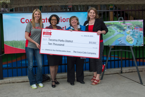 Coca-Cola Ambassador Anna Arodzero presents a $10,000 Grant to help fund a play and spray ground at  ... 