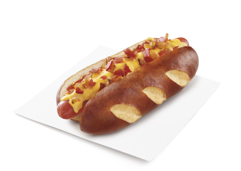 SONIC's new Pretzel Dogs feature premium beef hot dogs, nestled in a warm, soft pretzel bun. The Cheesy Bacon Pretzel Dog is topped with crisp bacon and warm melted cheese sauce, and the Original Pretzel Dog is topped with mustard. Both are available through August 11 at participating SONIC Drive-Ins nationwide. (Photo: Business Wire)