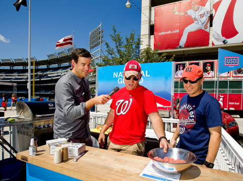 During Saturday’s Grill of Honor event, Carson Daly encourages a team of chefs from the National Guard as they fire up their grill for a friendly competition hosted by Lowe’s and the USO. Bragging rights and a donation of $100,000 to the USO on behalf of the winning branch were on the line. (Photo: Business Wire)