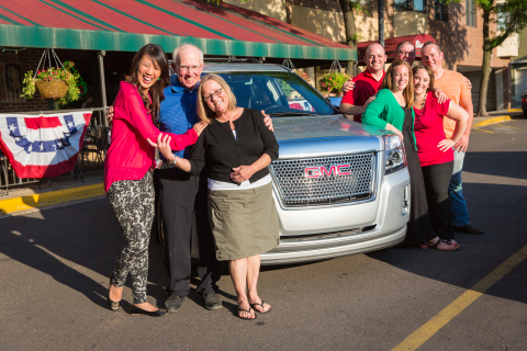 The HGTV Smart Home Winner Peggy Walker surrounded by her family and her new 2013 GMC(R) Terrain(R) Denali(R), part of her grand prize package.  HGTV, HGTV Smart Home, and HGTV Smart Home Giveaway are trademarks of Scripps Networks, LLC. Used with permission; all rights reserved. Photo(c) 2013 Scripps Networks, LLC.