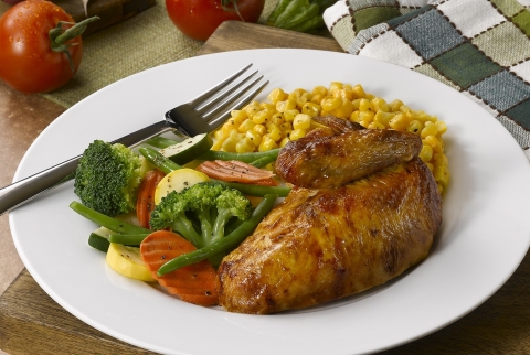 Boston Market is featuring several picnic-themed promotions throughout the summer. Menu items including rotisserie chicken (pictured) and barbeque ribs are ideal for summer picnicking. (Photo: Business Wire)