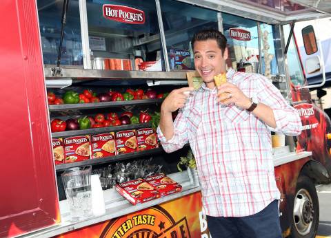 In this photo released by Nestlé Prepared Foods/Hot Pockets brand sandwiches on July 16, 2013 - Food Network's "Sandwich King" Jeff Mauro is seen on location with the new Hot Pockets brand sandwiches in Los Angeles. (Photo by Casey Rodgers/Invision for Nestlé Prepared Foods/Hot Pockets/AP Images)