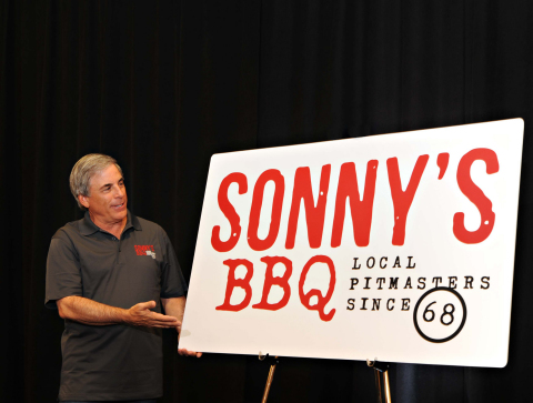 Sonny’s CEO Bob Yarmuth unveils the company’s new logo. (Photo: Business Wire)