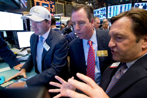 WCI Communities CEO Keith E. Bass conducting the first trade of WCI stock on the floor of the New York Stock Exchange. (Photo by Ben Hider/NYSE Euronext)