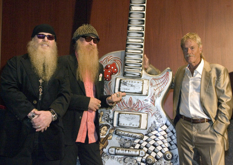 ZZ Top with the "Rockabilly" guitar, now on display at ABIA. Photographer: Gary Miller