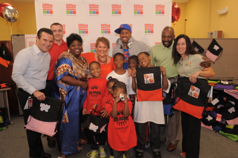 Fort Lauderdale, Fla. – Nick Cannon (center) joined the Office Depot Foundation in Fort Lauderdale, Fla. on August 2 to donate 7,500 sackpacks filled with essential school supplies to help children get ready for school. Cannon, shown here with Matthew Tomalewicz, Office Depot District Manager; Kevin Bowen, Office Depot Store Manager; Essie “Big Mama” Reed and the children of Big Mama’s Team of Life Organization; Mary Wong, Office Depot Foundation President; Michael Allison, Executive Vice President of Human Resources for Office Depot; and Christine Buscarino, Vice President of Marketing for Office Depot; assisted in handing out specially designed sackpacks to nonprofit organizations, schools and agencies that serve children in need in the Fort Lauderdale area. The Office Depot Foundation National Backpack Program has helped more than three million kids since 2001 (Photo Credit: Gort Productions).