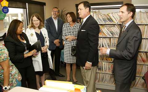 Gioconda Martinez (left), clinic manager of La Amistad de Jose Health Center, and Grainne McEvoy, M.D. (second from left), medical director of the health center, explain how the new $710,252 grant from UnitedHealthcare will help the clinic transition from paper to electronic health records. Left to right: Brian Jeffrey, west region president of network management at UnitedHealthcare, State Sen. Mimi Walters, Assemblyman Don Wagner, and Jeremy Zoch, executive vice president and COO at St. Joseph Hospital. The UnitedHealthcare grant to St. Joseph Hospital will help implement an electronic health records system that will connect 27 community clinics throughout Orange County to improve care delivery (Photo: Pedja Radenkovic).