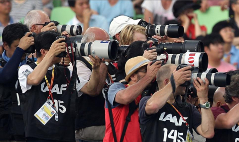 Photographers shoot the August 2011 IAAF World Championships in Daegu, South Korea. (Photo: Michael Steele/Getty Images) 

