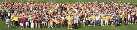 Dole's Bobby Banana and Valley Dairy's "Ice Cream Joe" Greubel lead a crowd of thousands at Saint Vincent College in Latrobe, Pa., in the world's largest banana gathering. The event was part of the Great American Banana Split Celebration, which honored Latrobe as the birthplace of the iconic dessert. (Photo: Jack Krall)