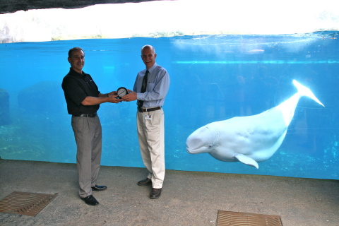 Steve Culmone, Ashcroft President & CEO making presentation to Keith Sorensen, VP Facilities & Capital Projects. Naku the Beluga whale looks on. (Photo: Business Wire)