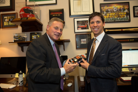 (L-R): Sen. Richard Burr (R-NC) and FedEx NASCAR driver Denny Hamlin show off the latest item to join Burr's sports memorabilia collection Thursday on Capitol Hill.  Hamlin was in Washington D.C. to accept the March of Dimes "Champion for Babies" award at the organization's 75th anniversary gala. (Courtesy: March of Dimes)