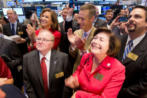 RE/MAX CEO Margaret Kelly in the center of the trading crowd as RE/MAX stock opens for trading on the NYSE. Source: NYSE Euronext photo