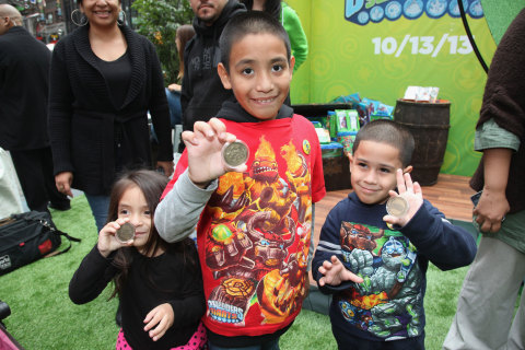 NEW YORK, NY - OCTOBER 10: In this photo distributed by Activision Publishing, Inc., kids take in all the activities of &ldquo;SWAPtoberfest&rdquo; &ndash; a life sized build out of the world of Skylanders in the middle of Times Square in New York to celebrate the Oct. 13, 2013 launch of Skylanders SWAP Force&trade;. (Photo by Donald Bowers/Getty Images for Activision)