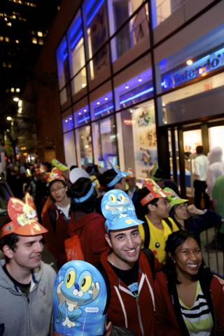 In this photo provided by Nintendo of America, Pokemon fans wait in line at Nintendo World in New York on Oct. 11, 2013, to be among the first in the U.S. to purchase the Pokemon X and Pokemon Y video games for the Nintendo 3DS family of systems, including the new Nintendo 2DS.