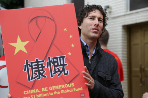 UNITED STATES—AHF's James Cuccia protests in front of the Consulate of the People’s Republic of China in Los Angeles, where about 130 protesters gathered Wednesday, October 23, 2013 to demand China pledge $1 billion to the Global Fund. (Photo: Business Wire)