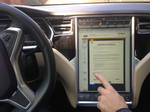 A user eSigns a 4506-T in a moving Tesla. (Photo: Business Wire)