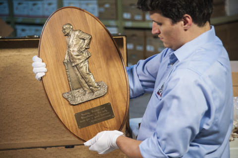 KFC employee Trevor Park holds a Colonel Sanders "Quality" Plaque, which features a likeness of the Colonel and is inscribed, "Quality, Service and Cleanliness is the only basis for a good business - Colonel Harland Sanders." The Colonel Sanders Collection auction, which concluded on Oct. 28, 2013, raised nearly $5,000 to benefit Feeding America and the World Food Programme. (Photo: Business Wire)