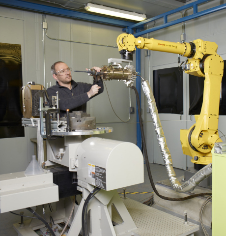 GE researchers are developing new ways to repair and even build up parts using a process called cold spray, or as we call it, "3D Painting." Metal powders are sprayed at supersonic speeds to build up and make parts. Here, GE materials engineer Leo Ajdelsztajn is in one of GE's spray booths preparing a test. (Photo: Business Wire)